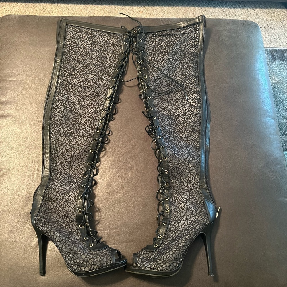 Laced up high heel back black boots